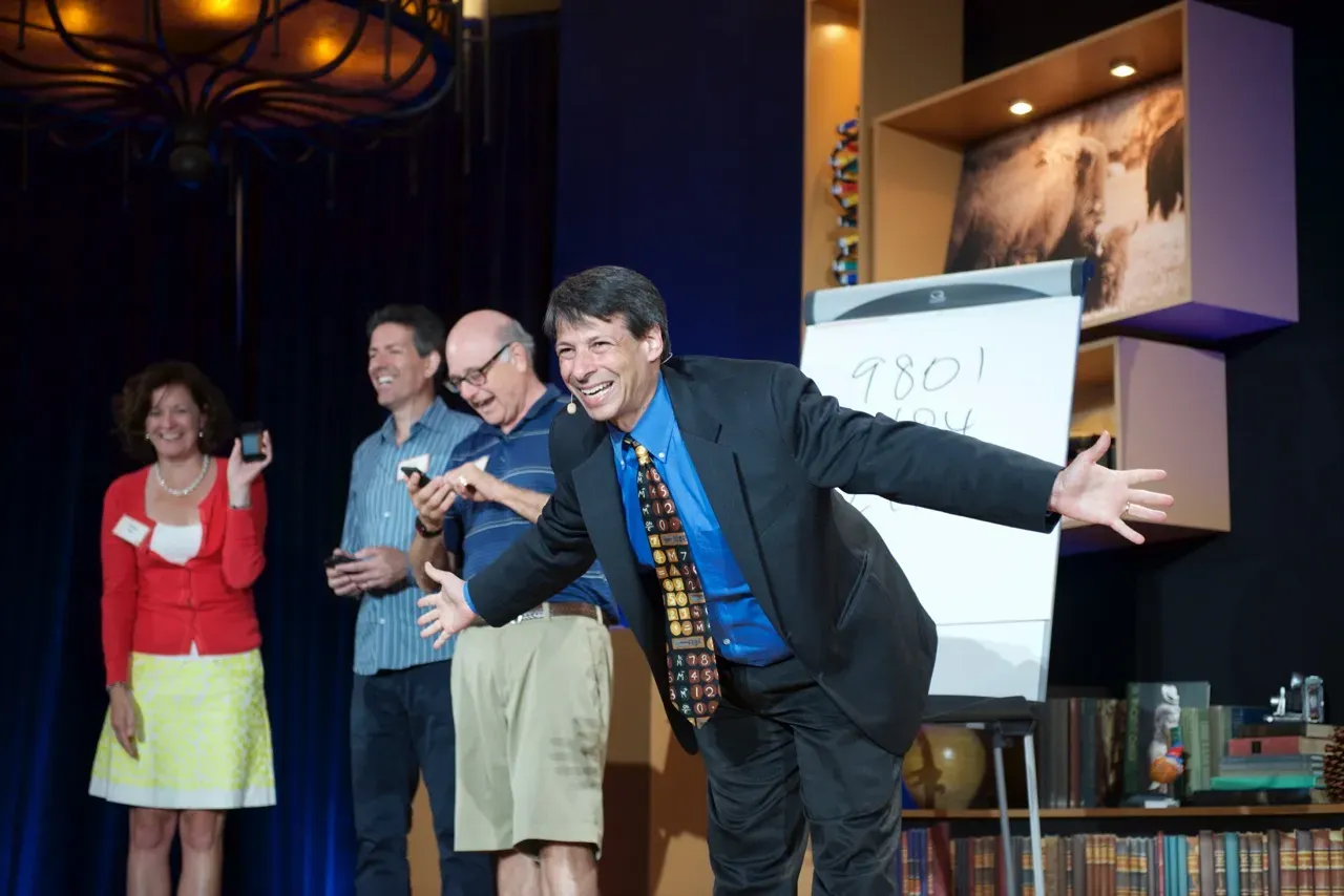 Arthur Benjamin taking a bow on stage following a Mathemagics performance in January 2016.