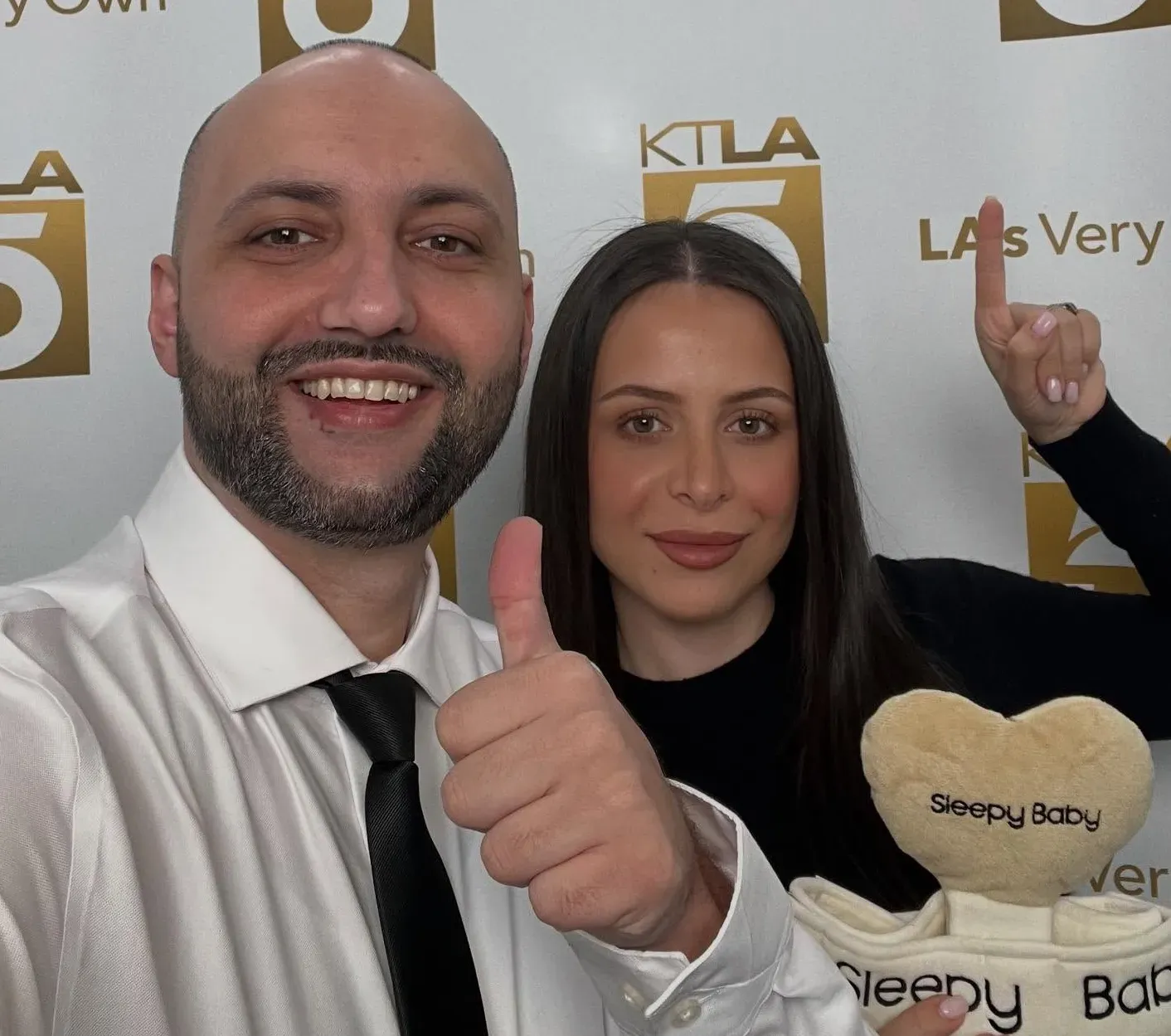 Sleepy Baby founders Gary Harutyunyan and Siran Kirakosyan with their baby-soothing device at KTLA 5